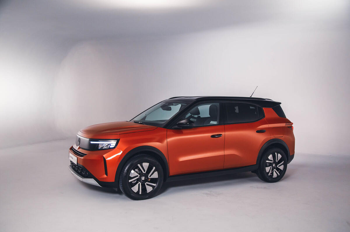 Orange Vauxhall Frontera in a studio   front three quarters