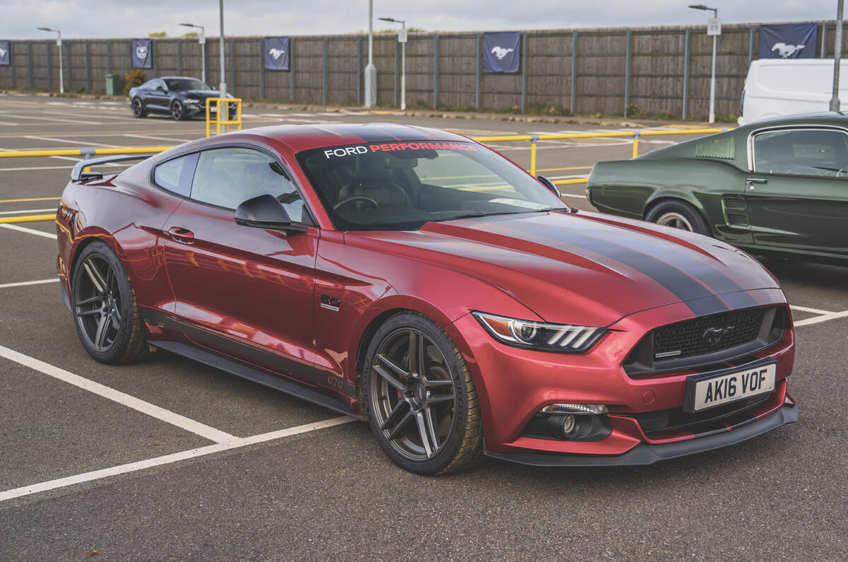 Parked dark red Ford Mustang