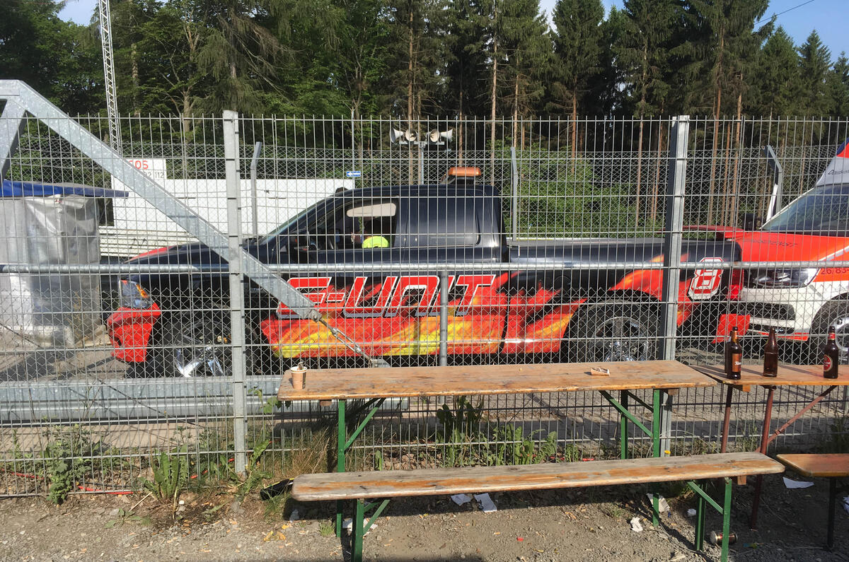 Car on fire? Then of course you need recovery by a pickup truck liveried in flames.