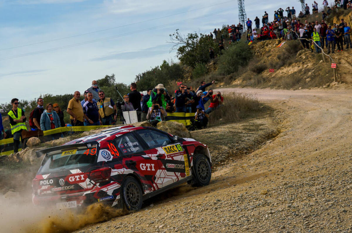 The Polo R5 competing in a rally event - rear 3/4