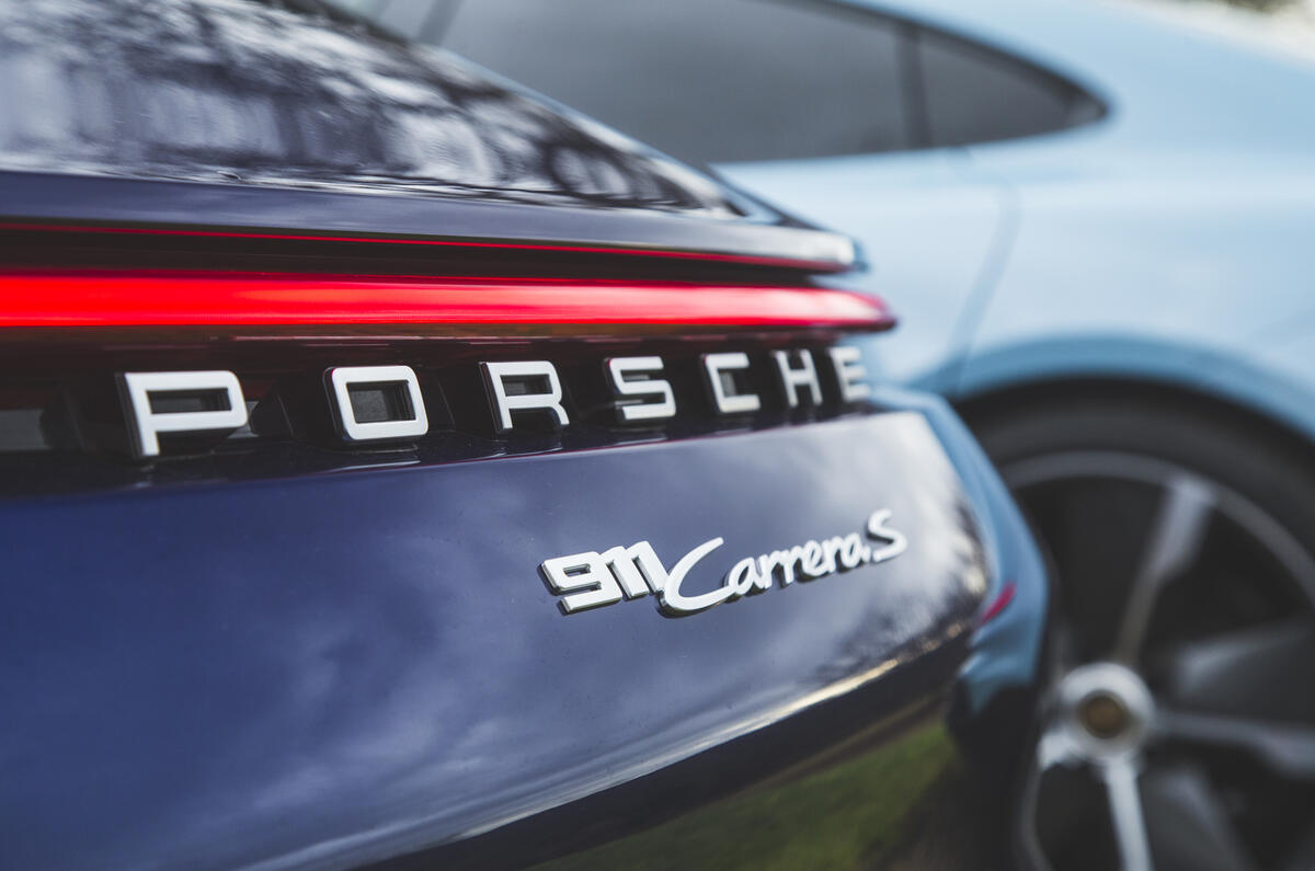 Porsche 911 2022 rear with Porsche Taycan 2022