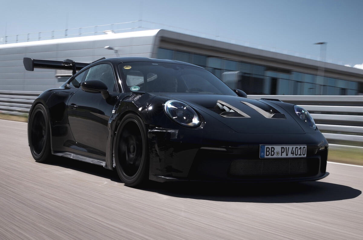 Porsche 911 gt3 2022 driving three quarters front