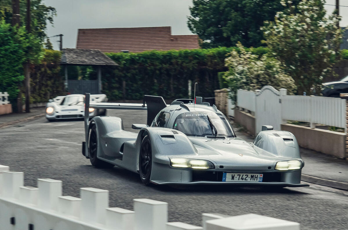 Porsche 963 RSP driving on street with 917 front quarter tracking Porsche 963 RSP driving on street with 917 front quarter tracking