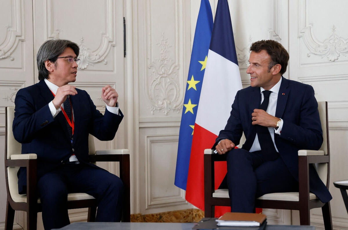 Prologium Vincent Yang L speaks President Emmanuel Macron R