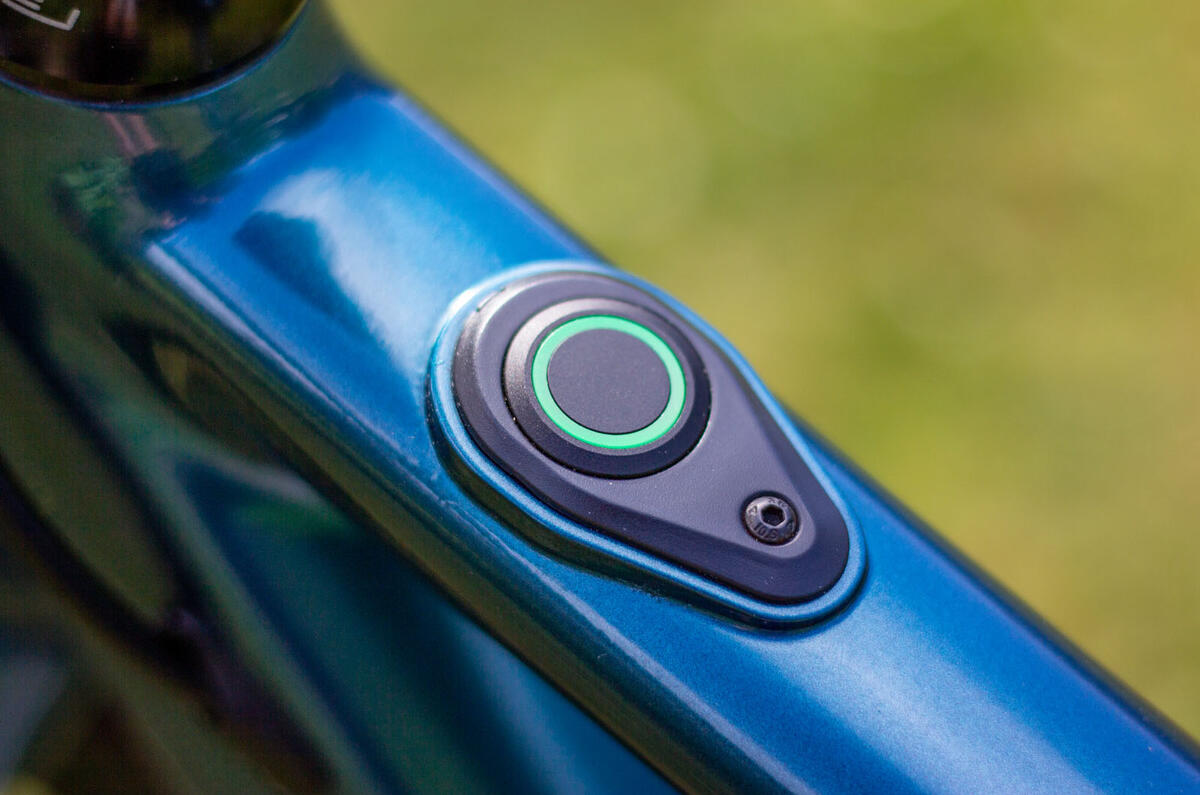 Sleek design is at the core of the Ribble Hybrid AL e's offering; this is the e-mode button