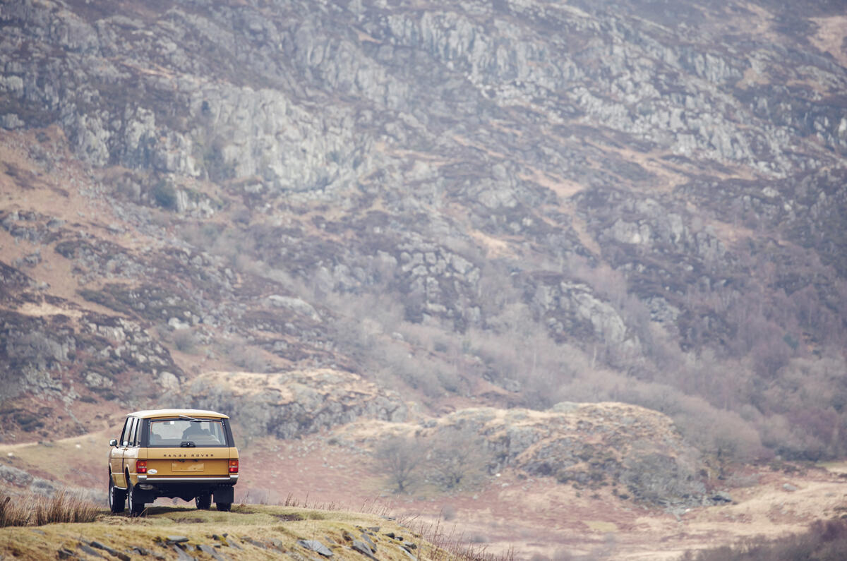 1978 two-door Range Rover before a mountain