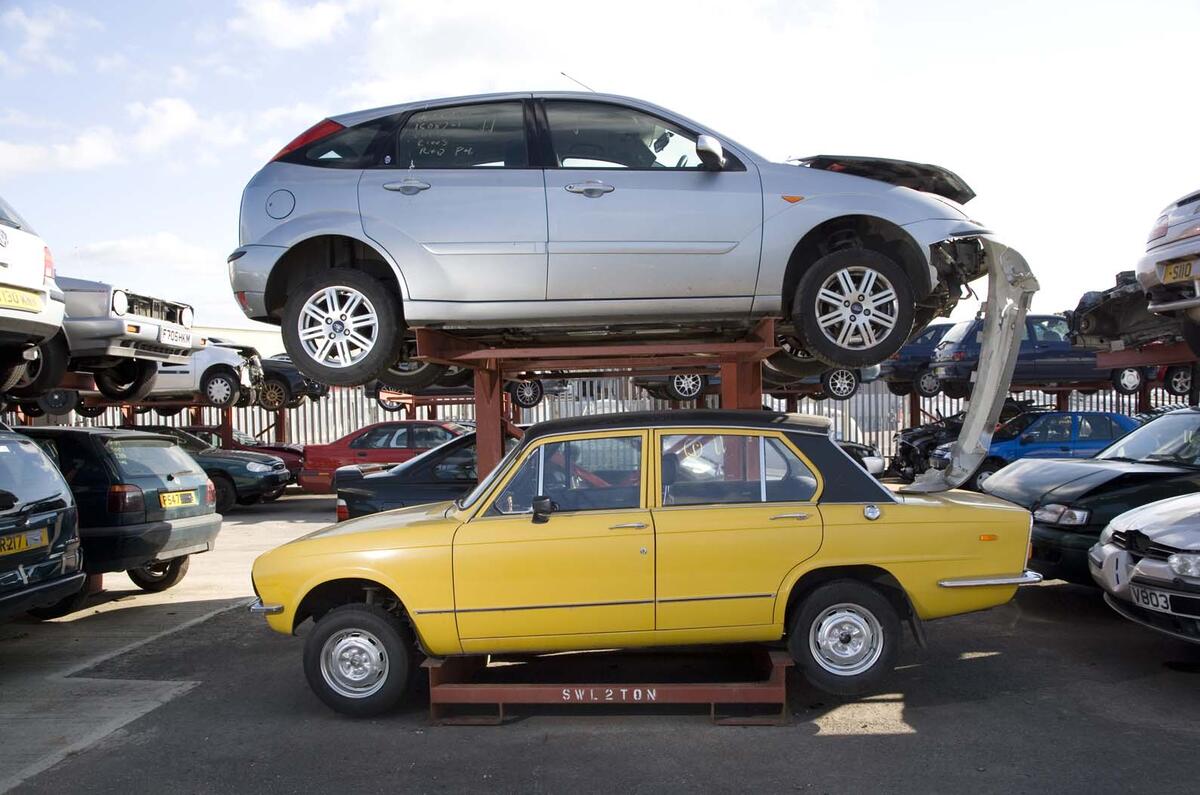 Triumph Dolomite and Ford Focus at scrapyard