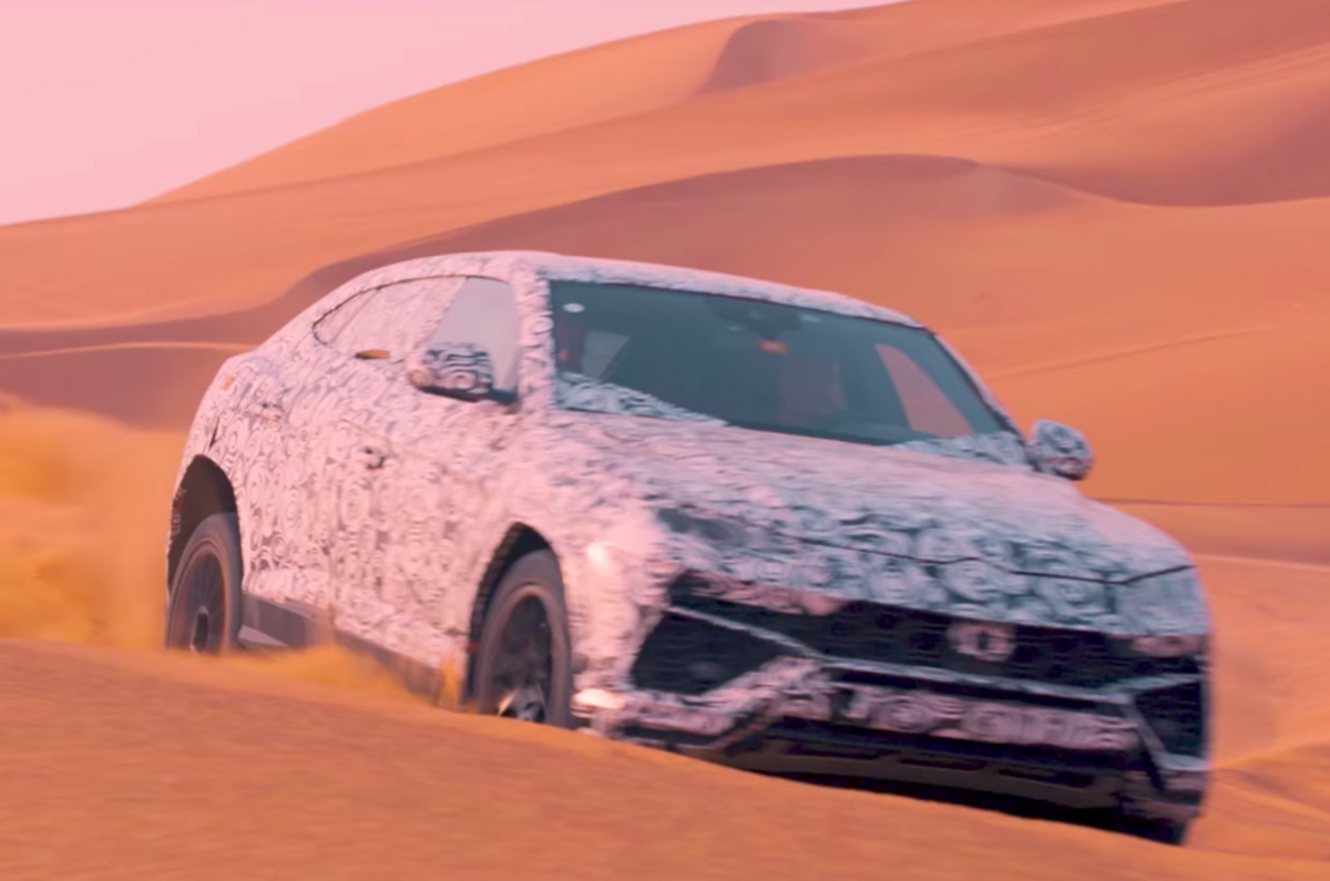 Lamborghini Urus on sand