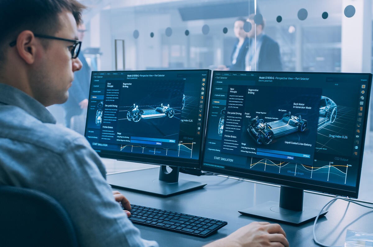 An engineer is woking on car designs on a computer screen