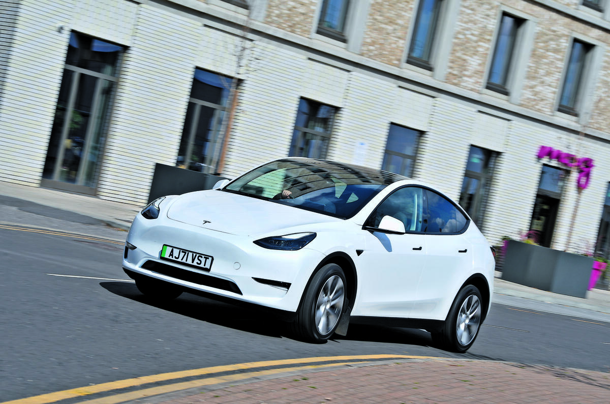 Tesla Model Y cornering through town