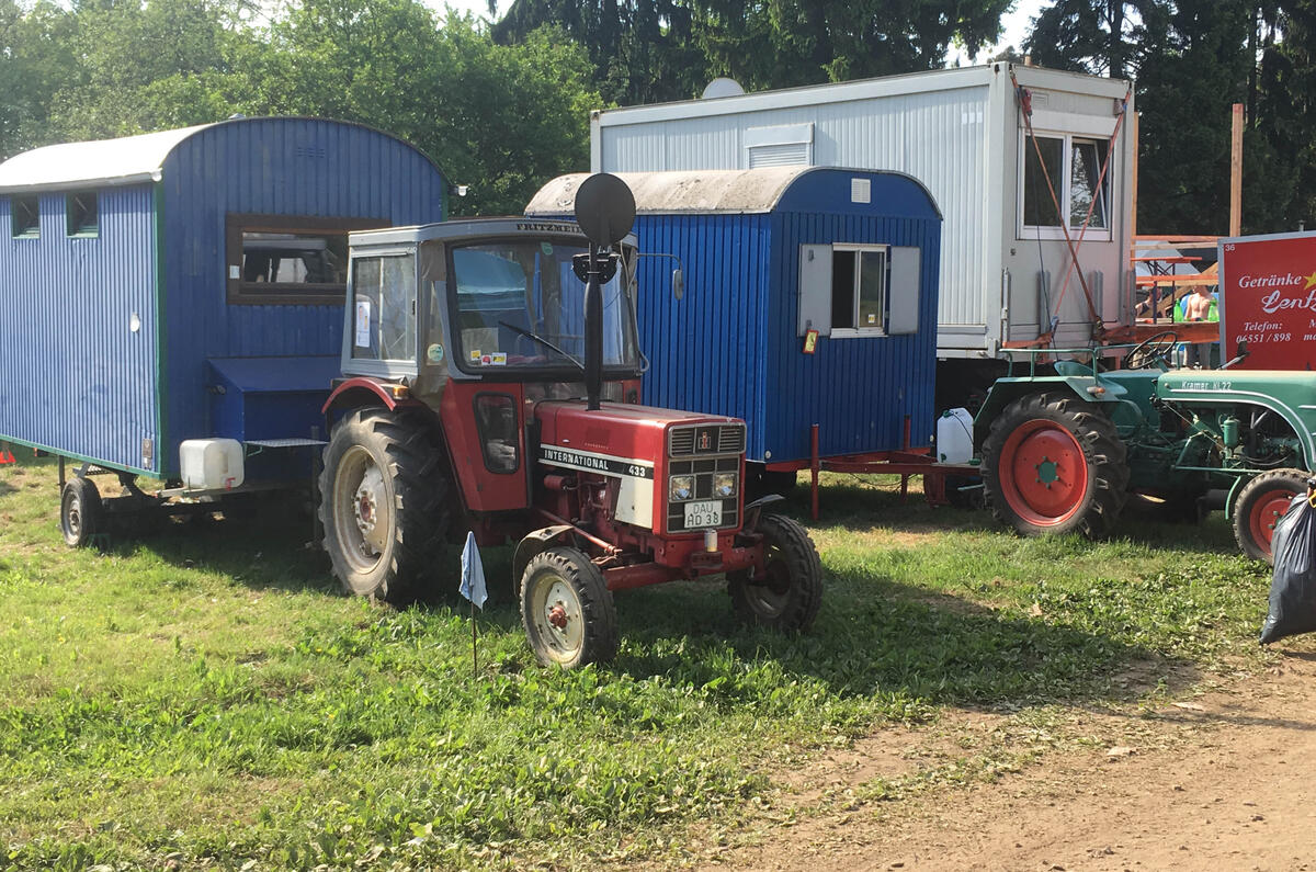 This is how the local N24 fans roll. With a tractor - and what looks like a homemade corrugated caravan. "Have you come far, then?"