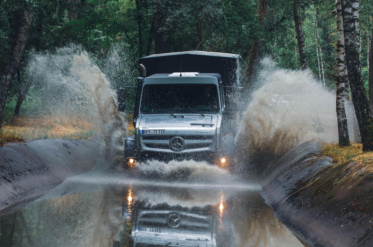 Unimog driving through water splash JH Unimog driving through water splash JH