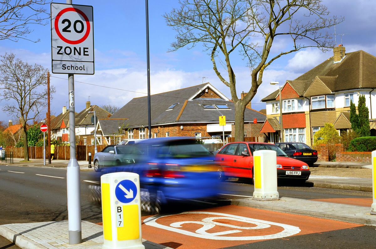 20mph speed limit sign on busy road 20mph speed limit sign on busy road
