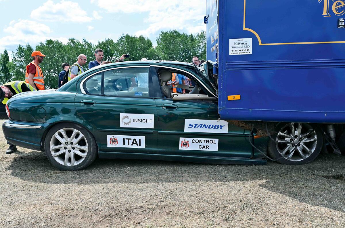 X type under lorry