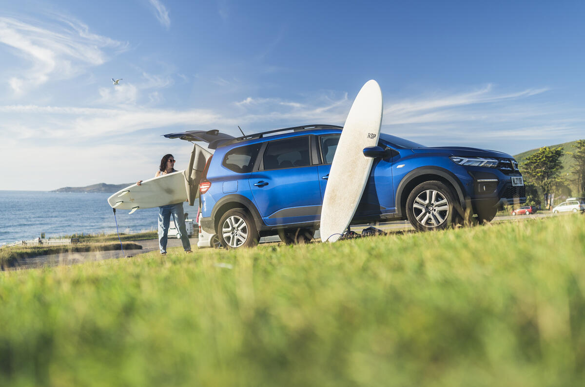 Dacia Jogger blue skies and surfboard Dacia Jogger blue skies and surfboard