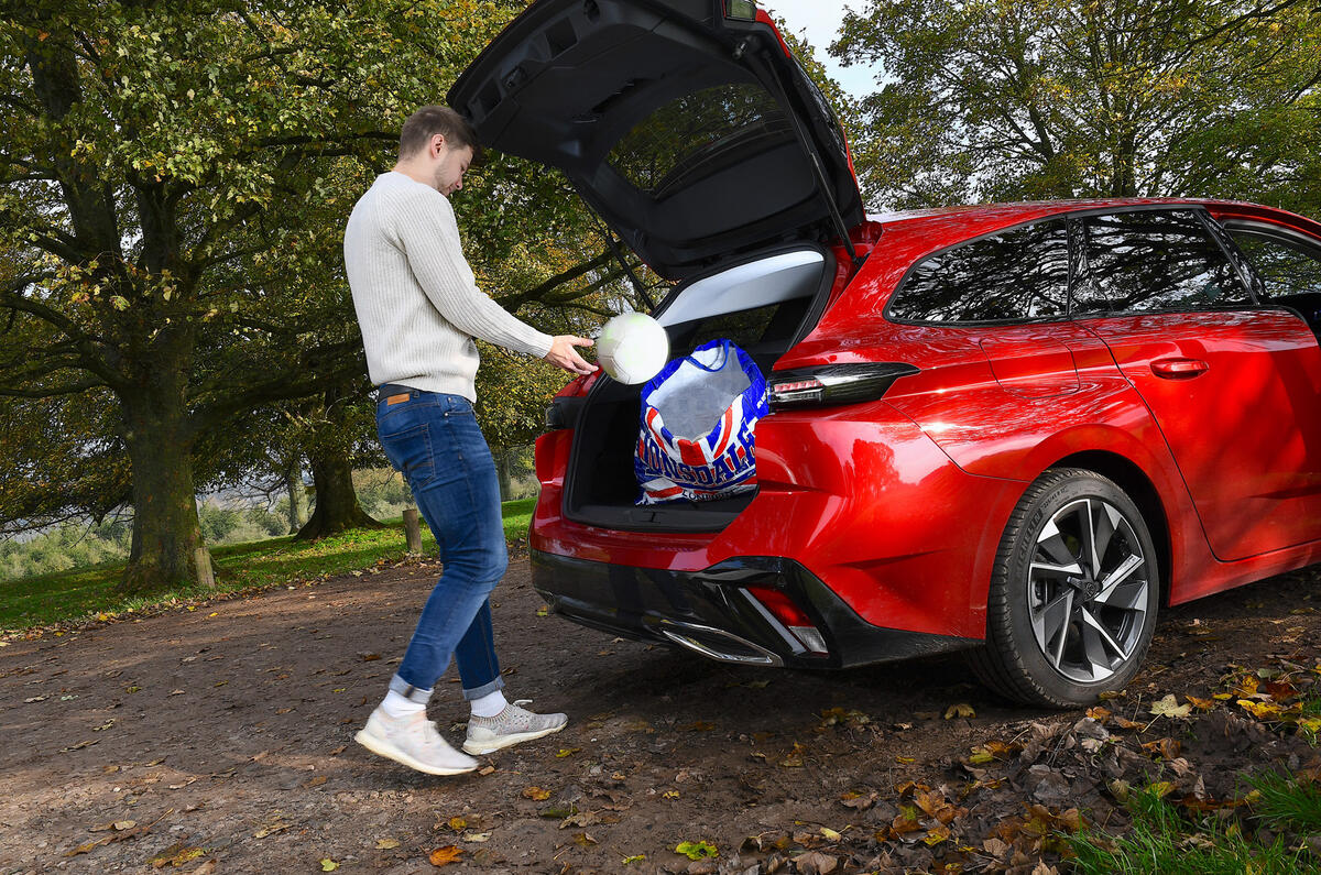 Peugeot 308 boot with person Peugeot 308 boot with person