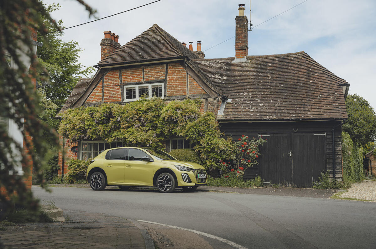 Peugeot e 208 parked in village Peugeot e 208 parked in village