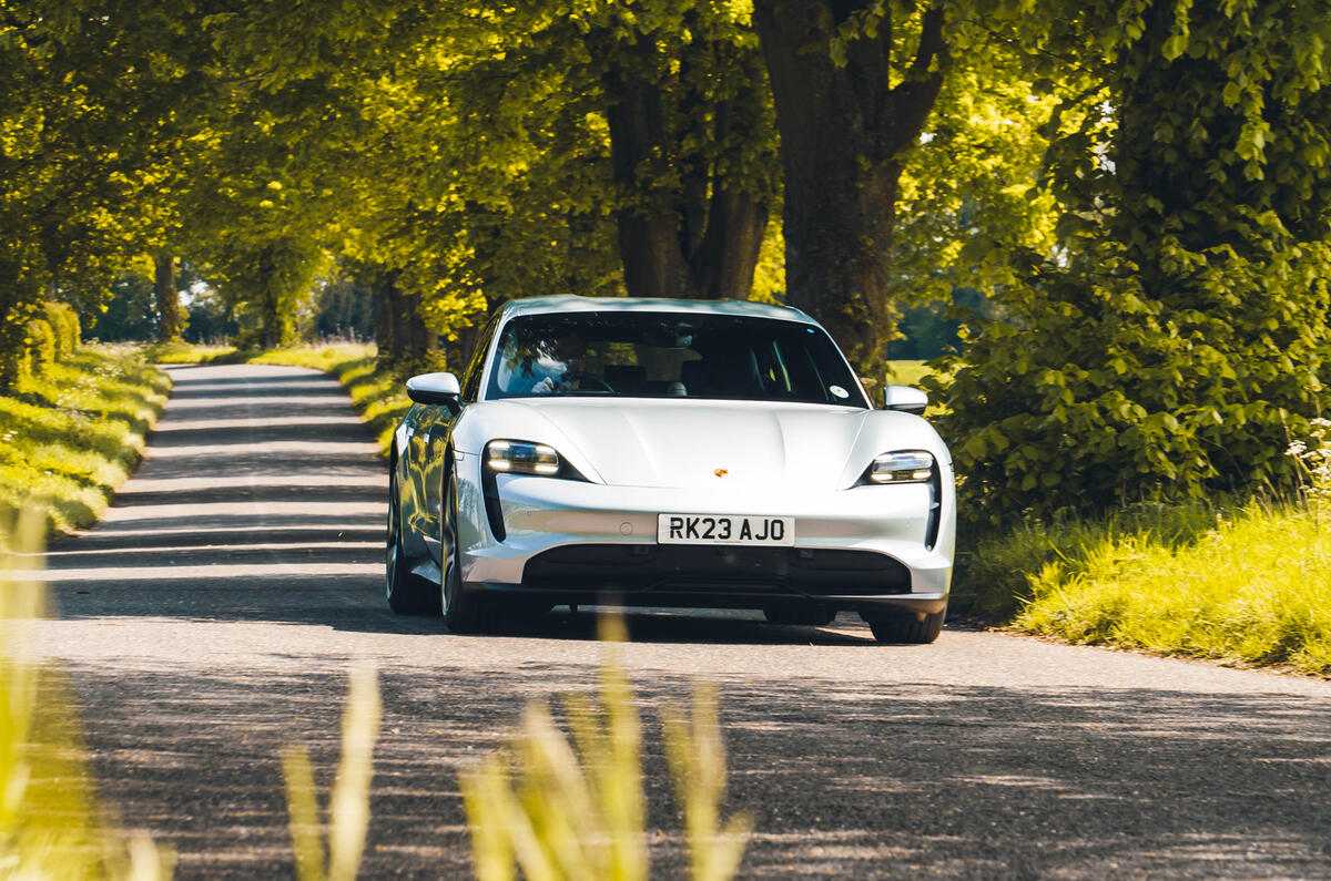 Porsche Taycan driving through trees 2