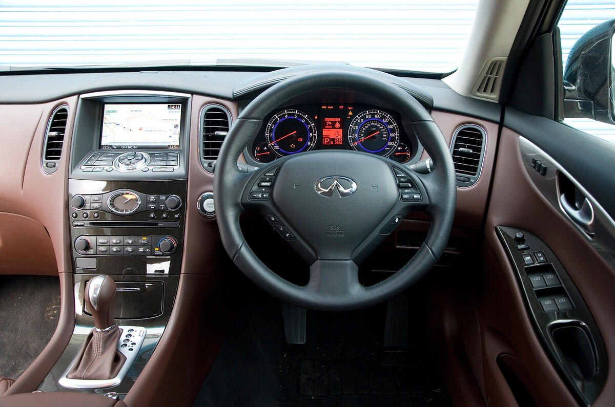 Leather-heavy cockpit has a rich, upmarket ambience Infiniti EX dashboard