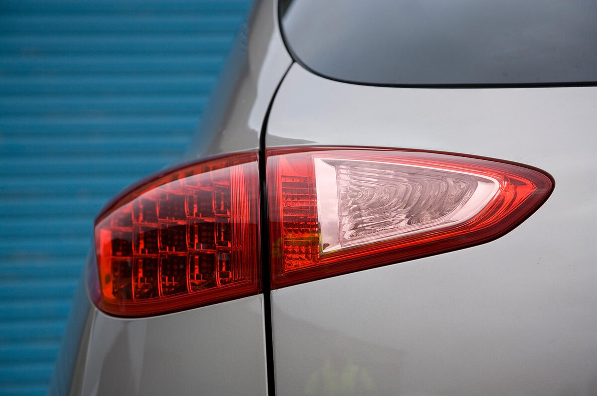 Slim, tapered rear lights echo the design of the headlights Infiniti EX rear lights