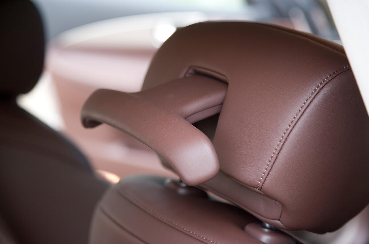 Headrest coat hanger is a practical touch Infiniti EX headrest coat hanger