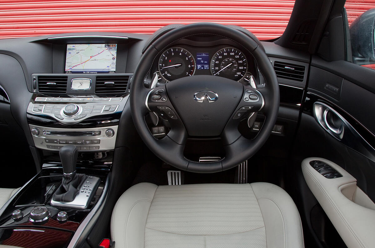 Touch screen is too far away; you can also control all functions via the scroll wheel below Infiniti M dashboard