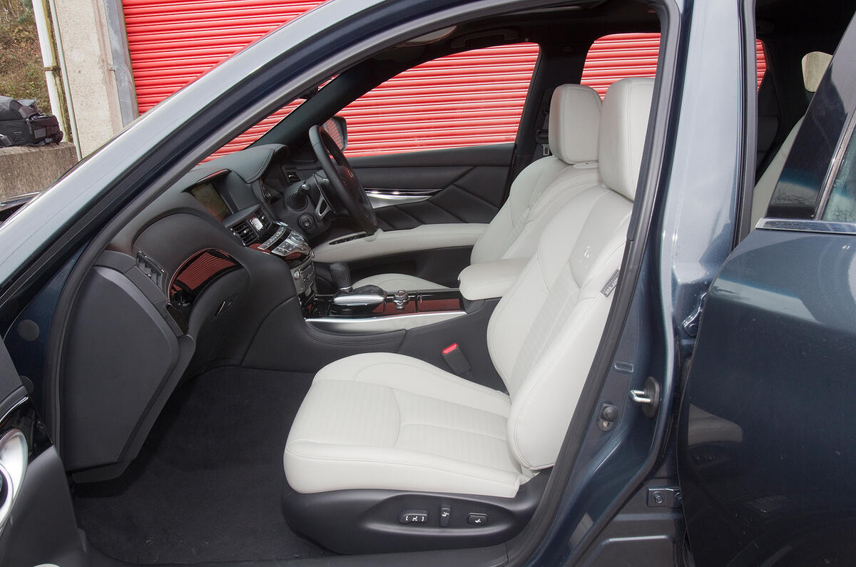 Cabin is snug and rivals Jaguar XF for ambience; driving position is hard to fault Infiniti M front seats