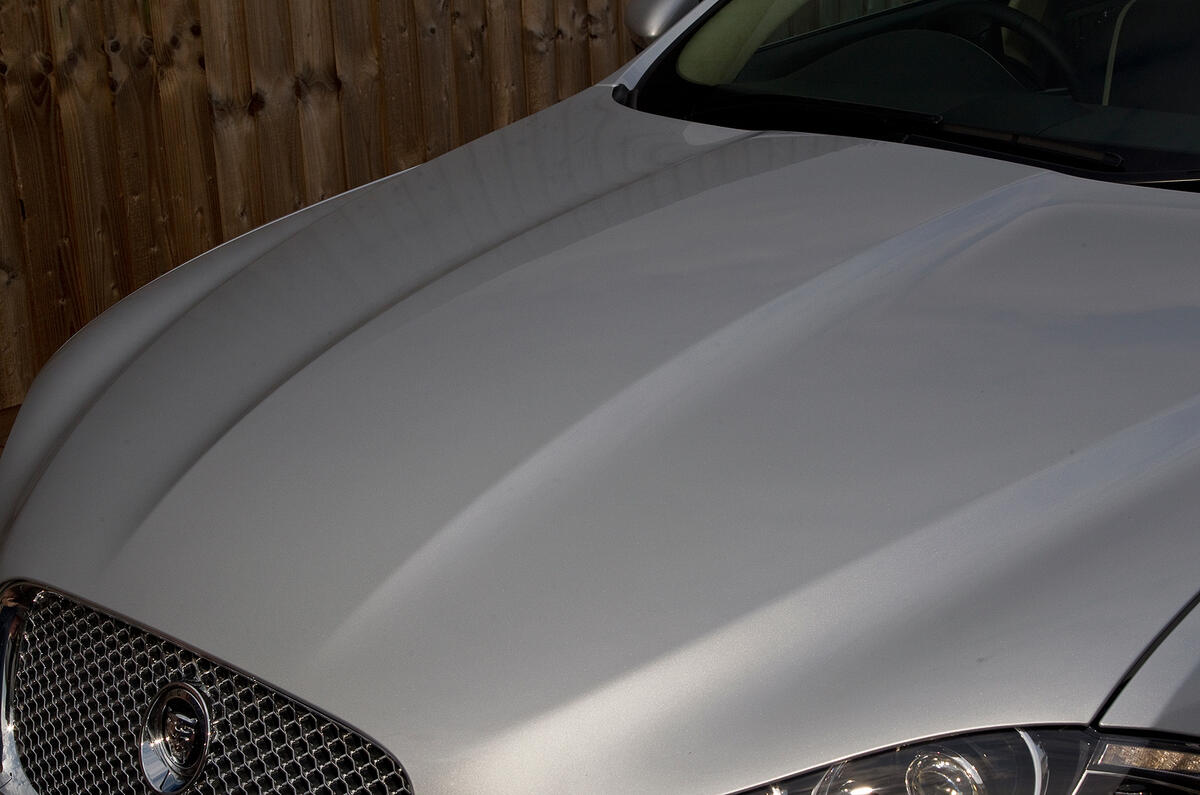 Bonnet curves down towards the grille, rather than ending in horizontal line; bulge is pronounced Jaguar XF bonnet curves