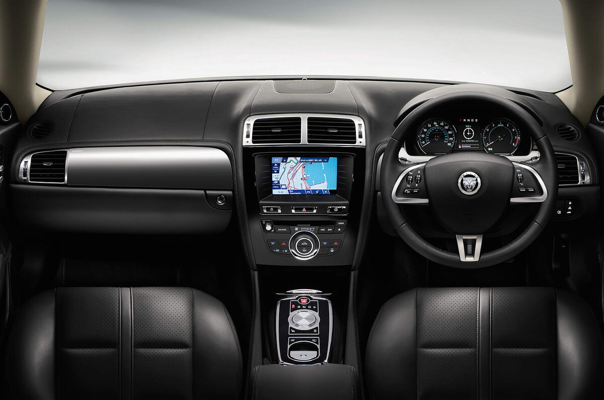 Attractive multi-function wheel works well but it is slightly awkward to grip the thick rim at quarter to/past mark Jaguar XK dashboard