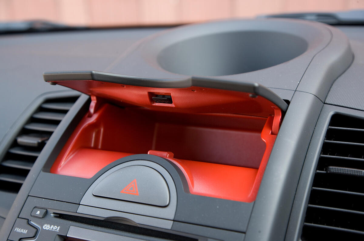 Red lining for glovebox and centre console box is quite a surprise when you open the lids. Rubber anti-slip mats would be useful Kia Soul red-lined glovebox