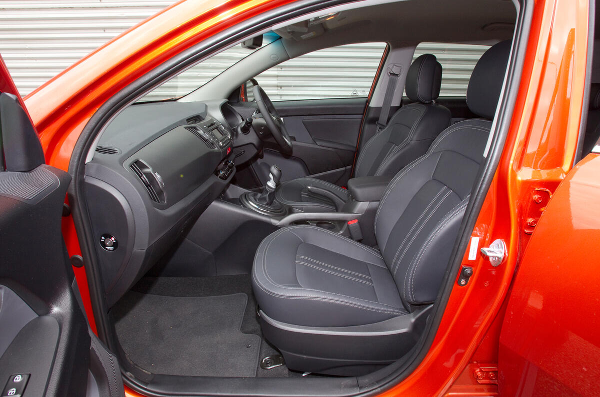 Front seats are comfortable and give an elevated view out. Space is decent, too Kia Sportage front seats