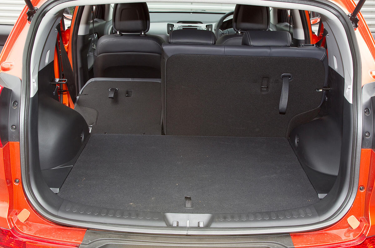 Boot is a practical shape and expands to 1353 litres. Rear seat splits 60/40  Kia Sportage boot space