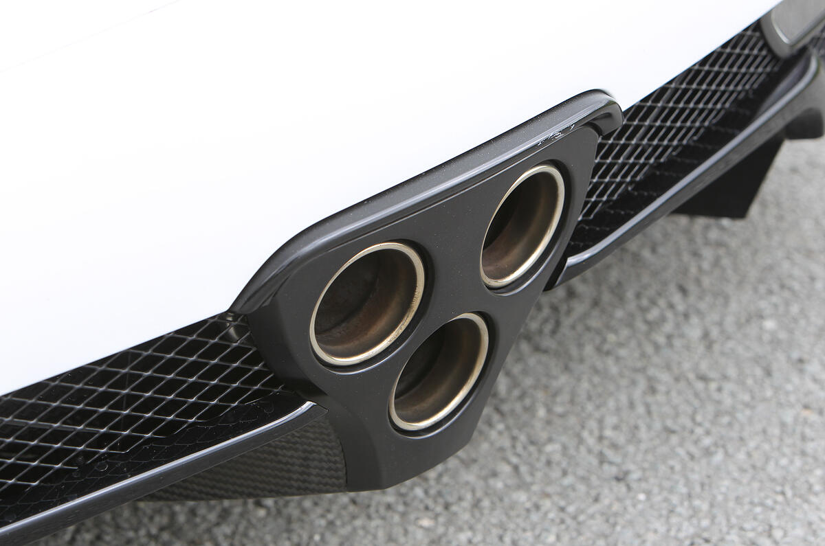 Triple exhausts add symmetry to the rear end emitting a raucous, F1-like sound Lexus LFA triple exhaust system