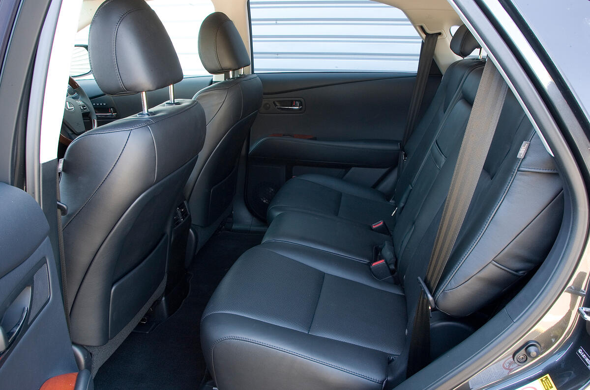 Decent amounts of leg and head room; battery pack is beneath the seats Lexus RX rear seats