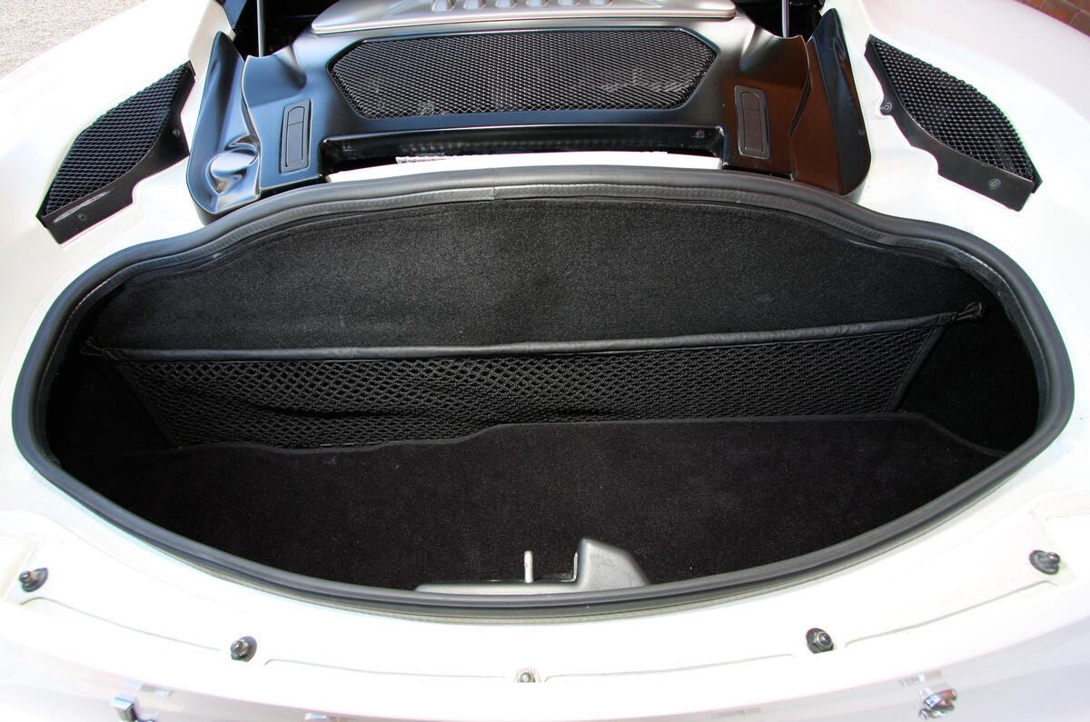 Small boot, aft of the mid-mounted V6, will take soft bags for weekends away Lotus Evora boot space