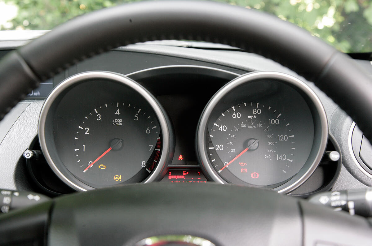 Dials are easy to read. Secondary information is displayed centrally in the dash Mazda 3 instrument cluster