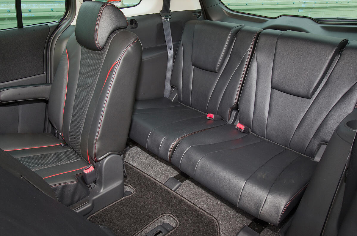 Sliding doors offer convenient access to middle seats, which can slide forward Mazda 5 third row seats