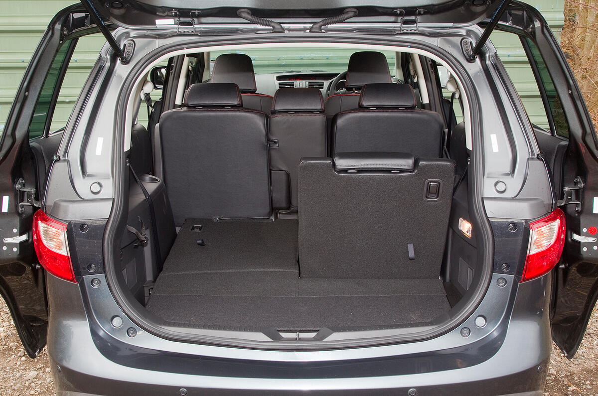 Boot dimensions are adequate; small middle seat can fold away to leave a gap Mazda 5 seat flexibility