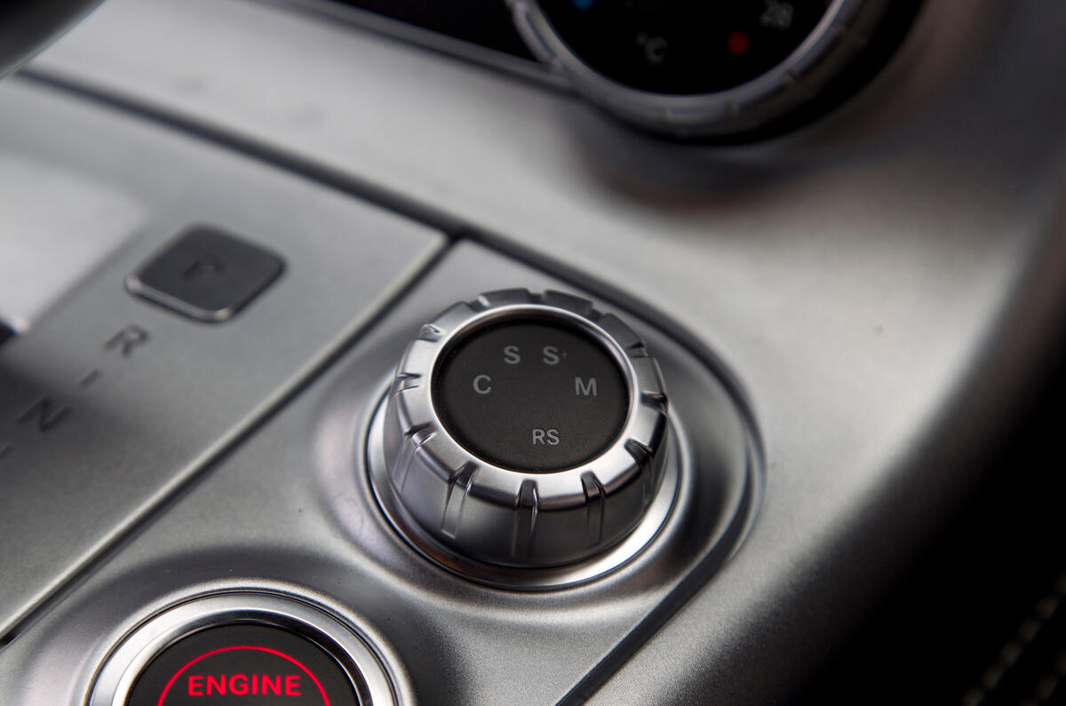 The cabin is designed to look like an aircraft cockpit, with buttons angled towards the driver Mercedes-AMG SLS ignition button