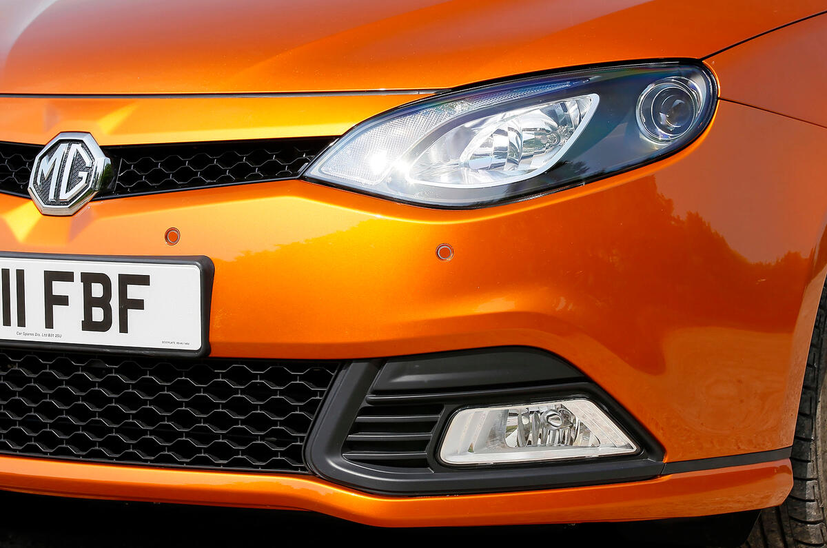 A large black honeycombe grille and solid foglight surrounds dominate the front end MG6 front foglights