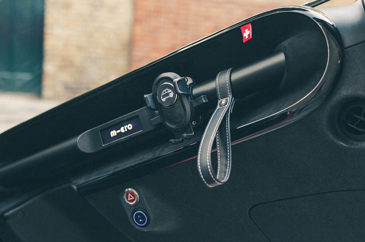 Microlino phone holder and grab strap Microlino phone holder and grab strap