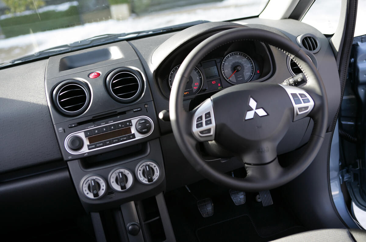 The dash is laid out neatly and clearly enough Mitsubishi Colt dashboard