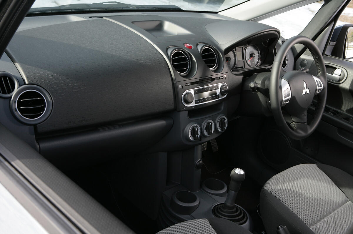 Some of the materials are a bit cheap, but it's generally fine in here Mitsubishi Colt interior