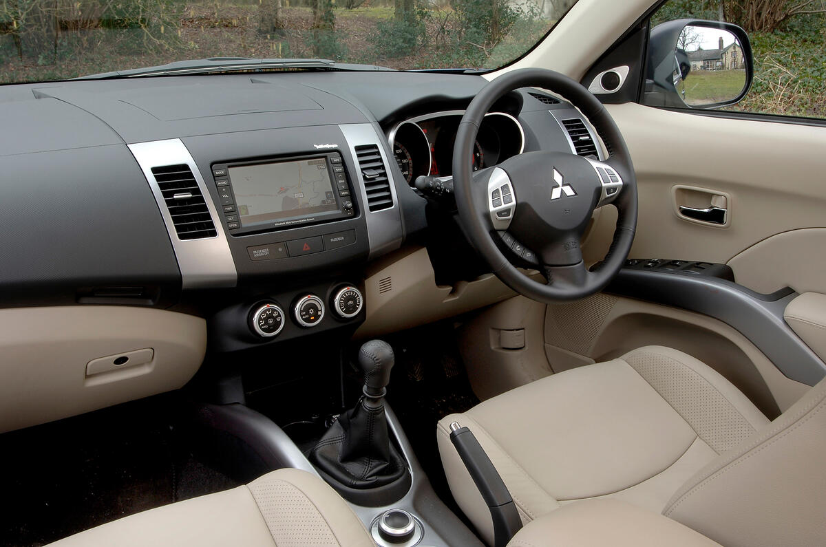 Cabin finish varies, with brittle plastics on the bits you touch Mitsubishi Outlander interior