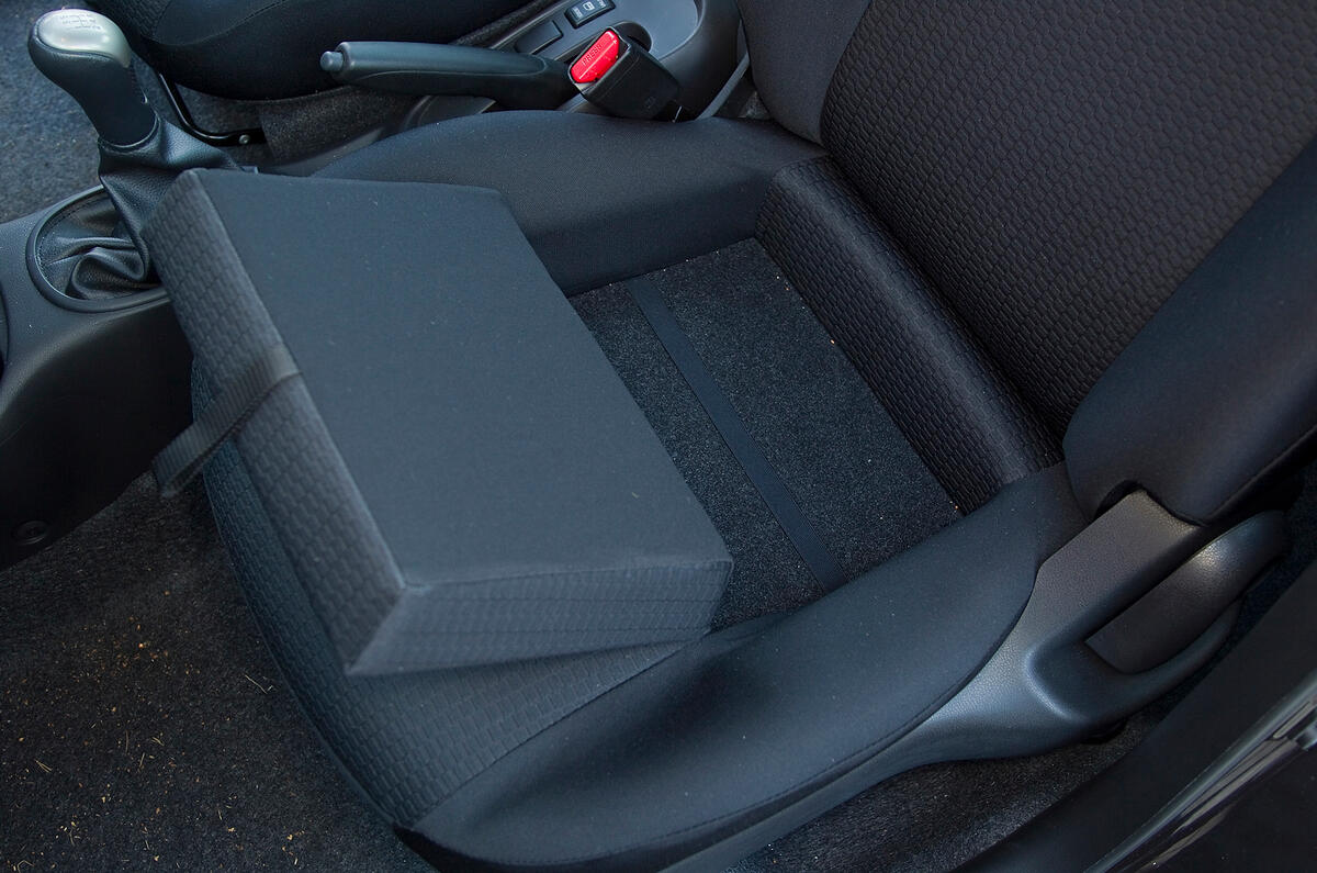 Seat cushion lifts out, but you can't store anything underneath Nissan Micra front seat storage
