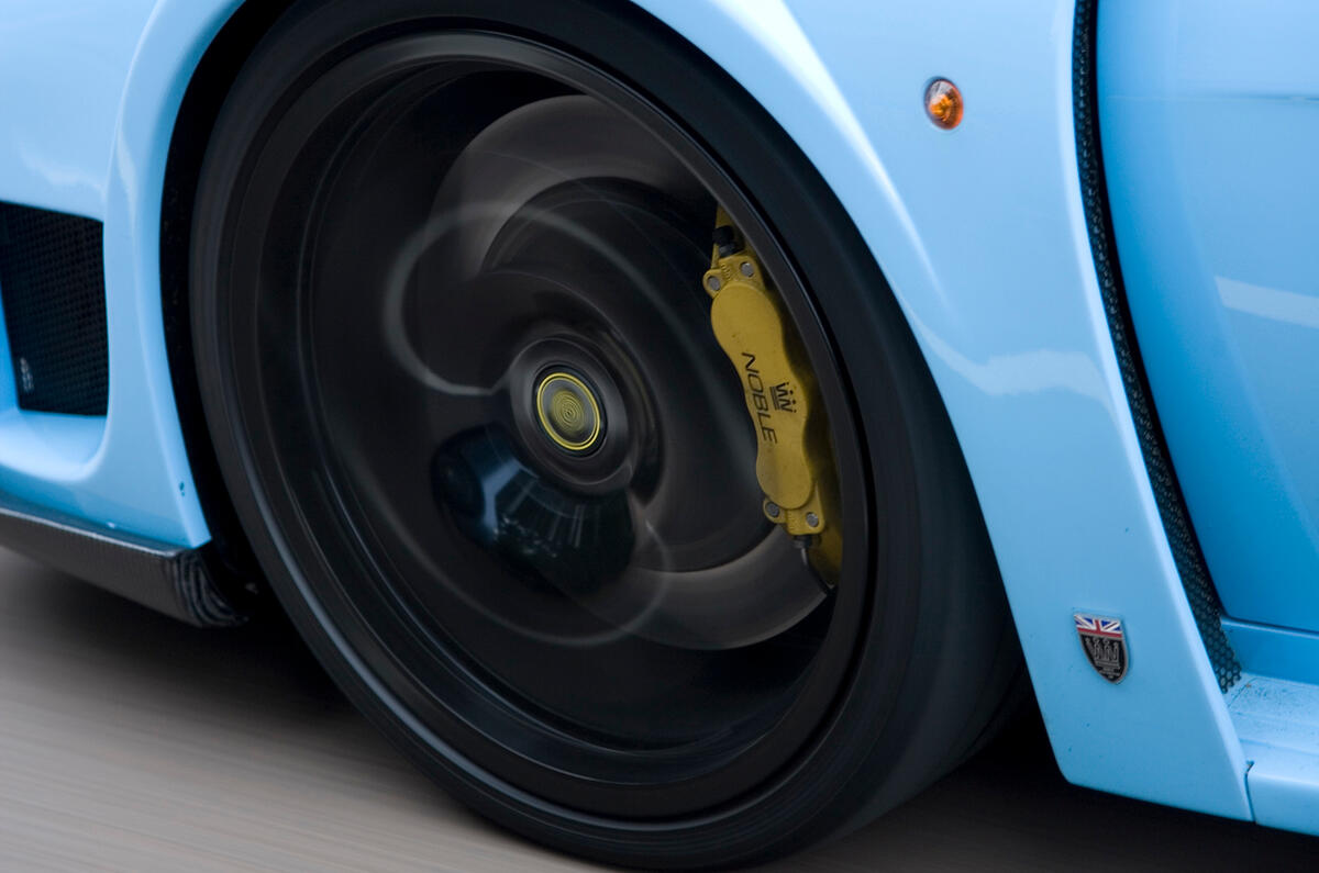 Six-pot calipers are fitted at the front, with four-pots at the rear. ABS isn't offered Noble M600 black alloy wheels