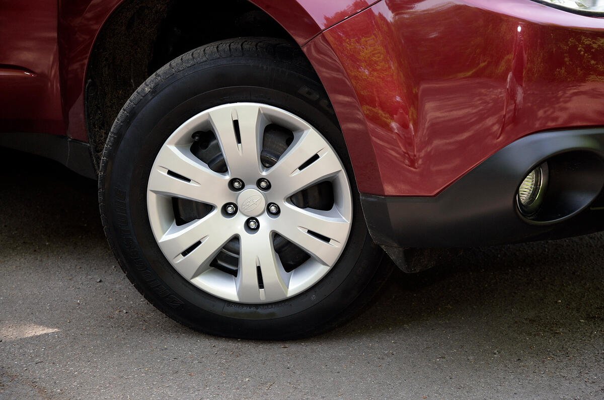 These look like alloy wheels but they're actually steel wheels with plastic trims Subaru Forester plastic hub caps
