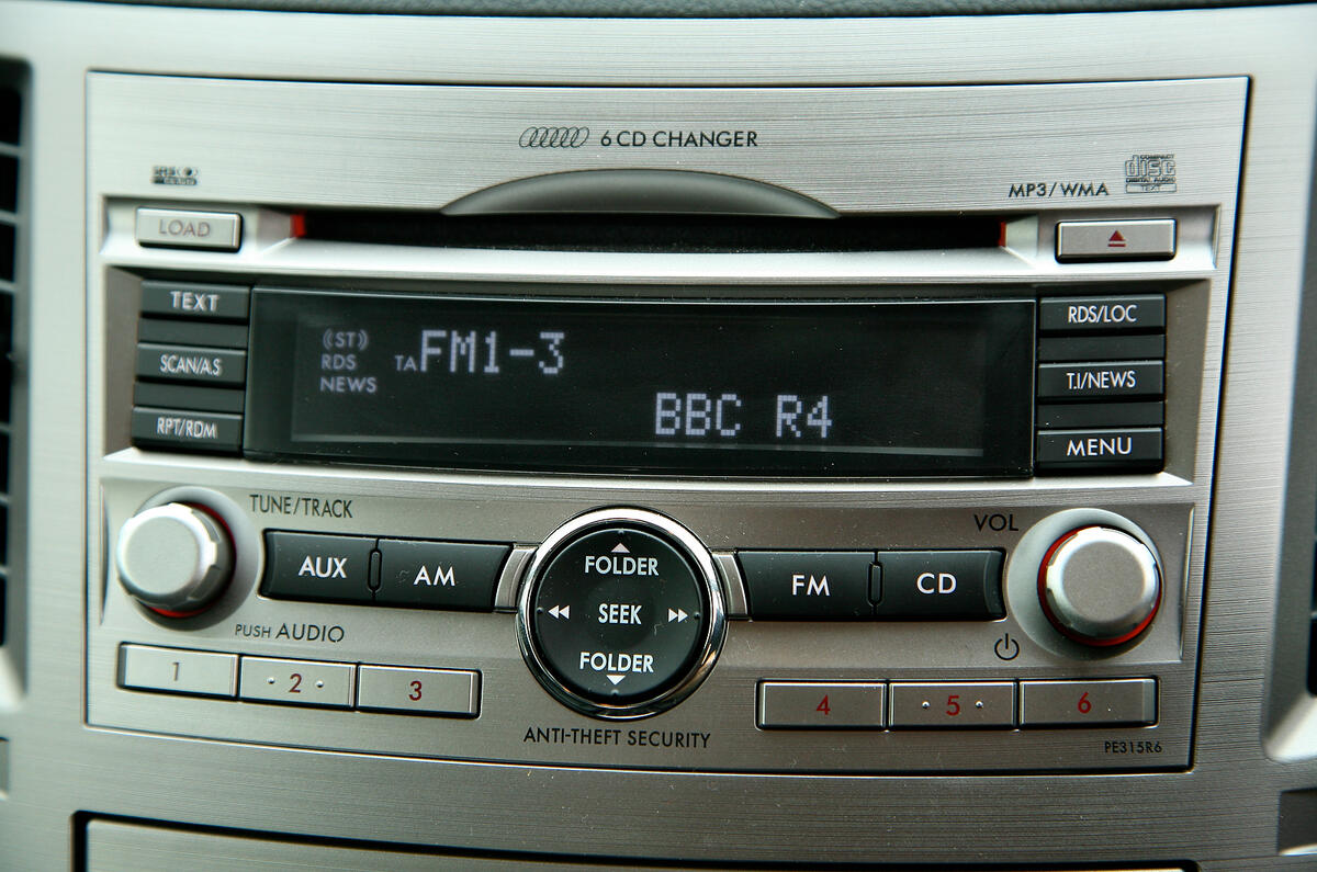 The integrated stereo sits within a huge swathe of silver-coloured trim Subaru Legacy infotainment system