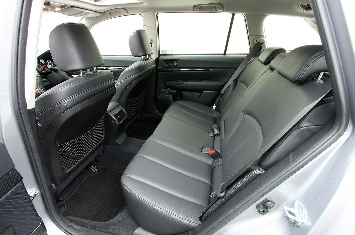 Wide cabin allows three adults to sit across rear bench; leg room is plentiful Subaru Legacy rear seats