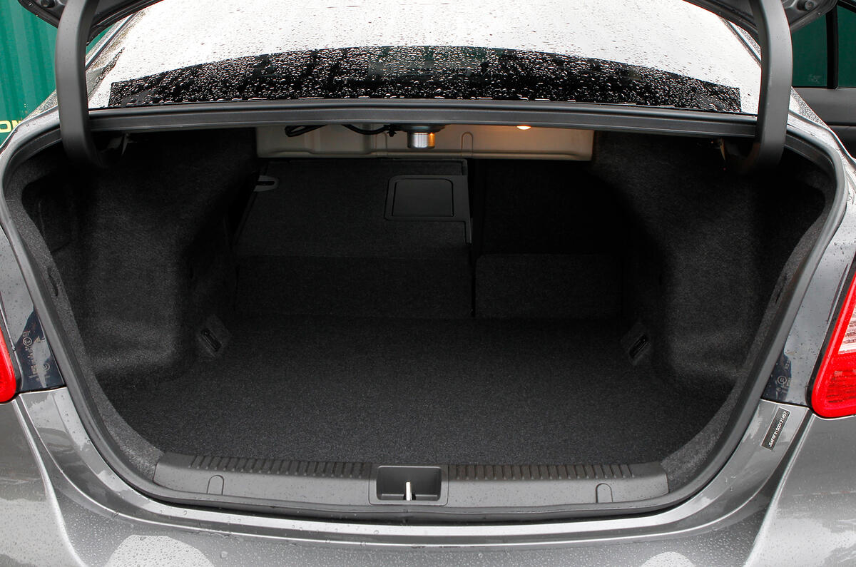Kizashi’s boot is small, and isn’t helped by rear axle and suspension intrusion Suzuki Kizashi boot space